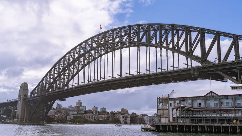 Sydney Harbour Bridge over the water on a clear day.